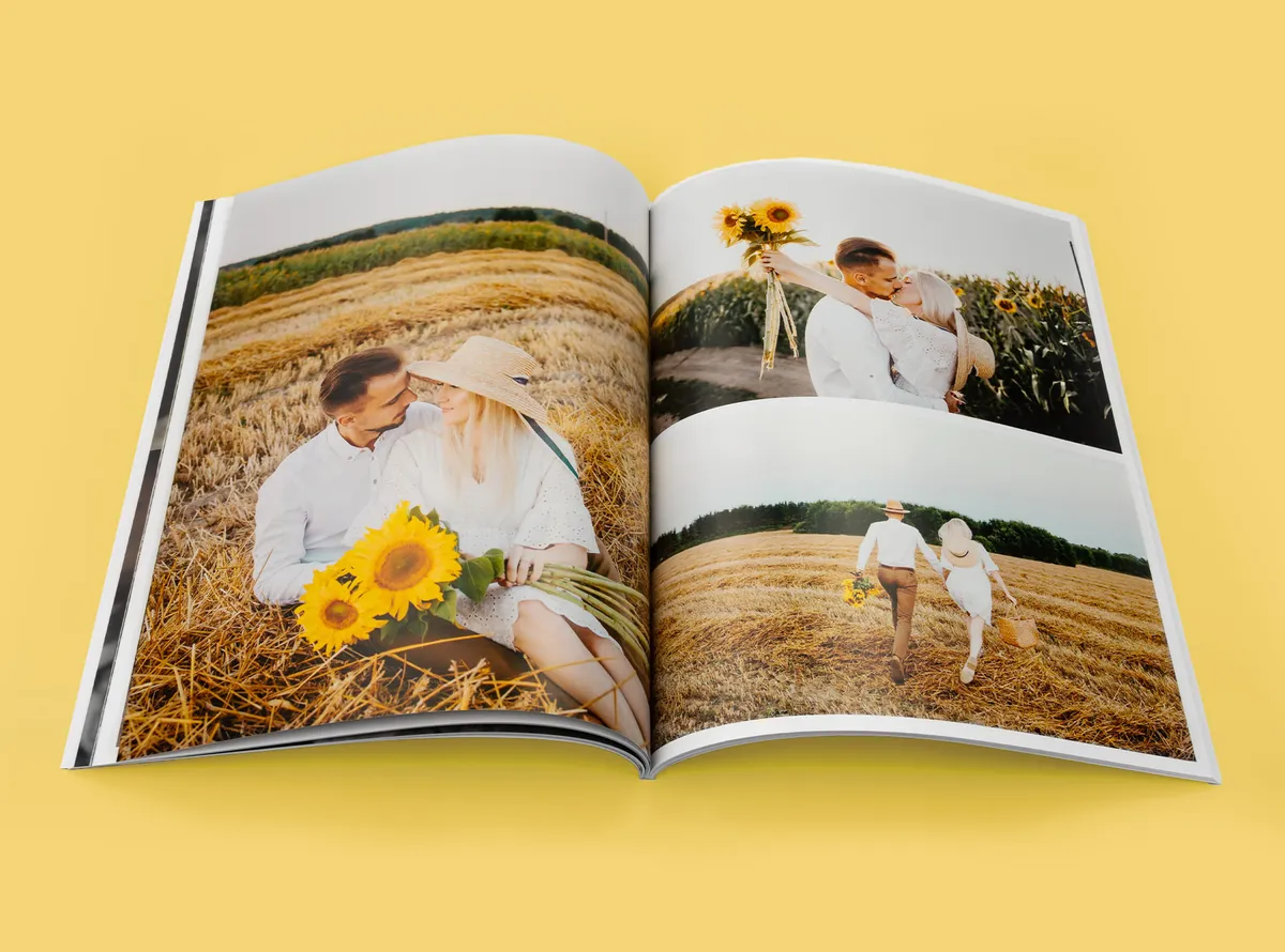 Softcover Fotobuch mit Paarfotos auf einem Sonnenblumenfeld